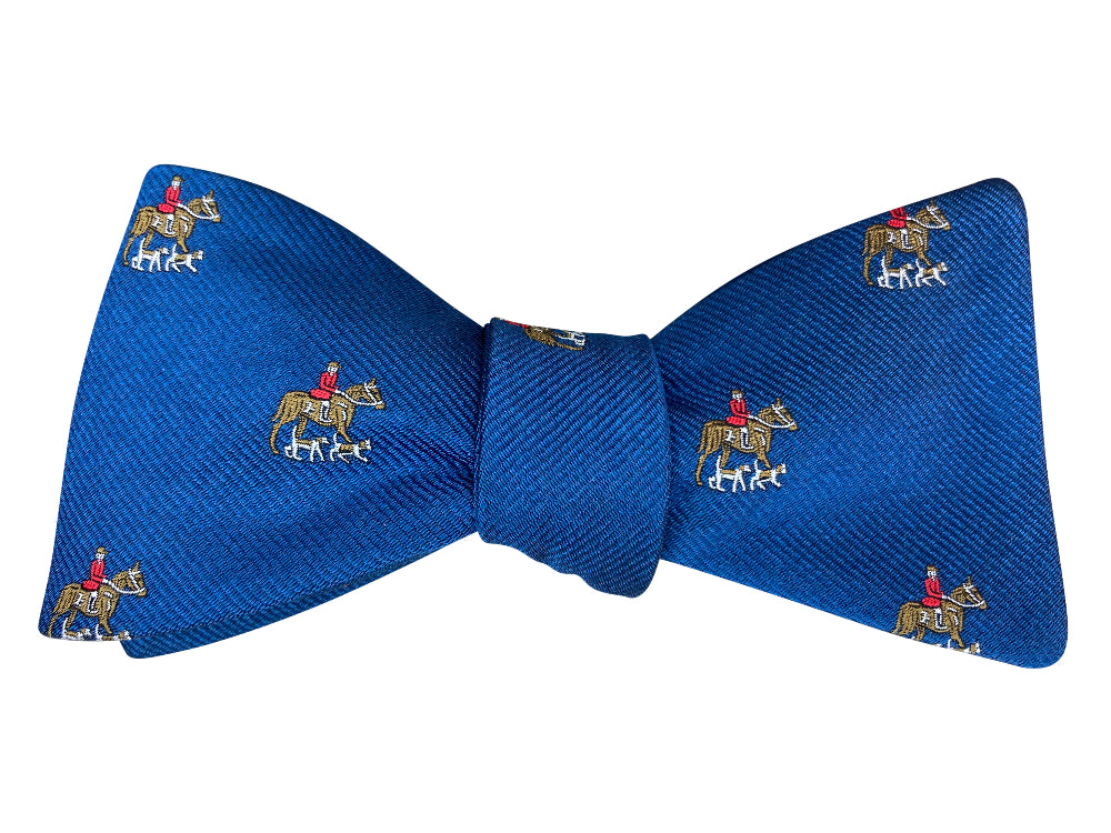 blue jacquard silk self tie bow tie with a horse and hounds motif